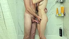 petite brunette girl moans loud while showering her tight body