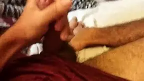 A young skinny amateur beats his monster cock in the bedroom.