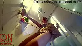 hidden camera catches a young naked girl stripping down in the shower room for a steamy view