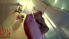 hidden camera catches a young naked girl stripping down in the shower room for a steamy view