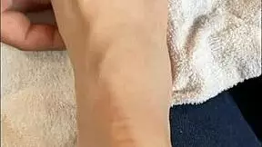 latina girl talks to followers while showing barefoot feet and toes