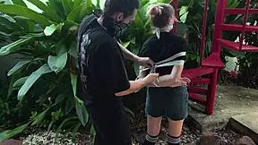 is this blonde beauty tangled in park bondage?