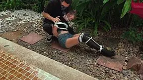 is this blonde beauty tangled in park bondage?