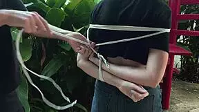 is this blonde beauty tangled in park bondage?