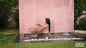 Big-tits top model Lucy Li masturbates under the waterfall outdoors.