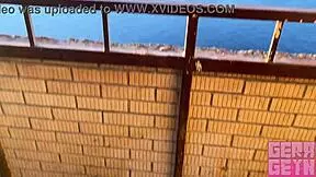 Hey, watch this smoking girl suck fast on a public balcony!