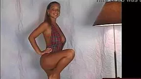 busty teen in sexy slingshot dress dancing seductively