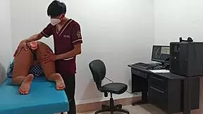 Doctor examines tall teen with long hair in clinic