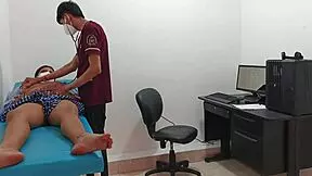 Doctor examines tall teen with long hair in clinic