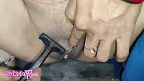 A sexy teen Indian girl shaves her pussy in her room.