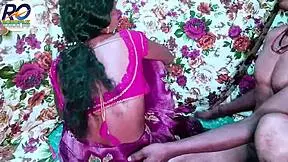 Desi bhabhi in a vibrant red saree, passionately kissed