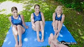 Three Gymnasts Blow Cock Outdoors
