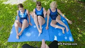 Three Gymnasts Blow Cock Outdoors