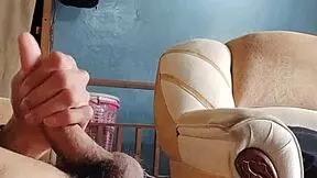 Masturbating my cock hard in the living room - damn hot!