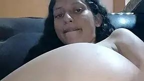 Latina enjoys solo masturbation on furniture almost caught