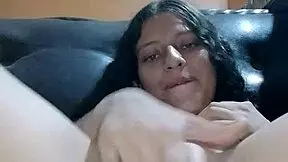 Latina enjoys solo masturbation on furniture almost caught