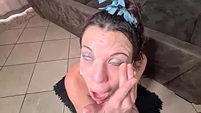 Petite whore gets her eye covered in cum after jerking off cock
