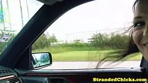 hitchhiking brunette flashes her tits outdoors.