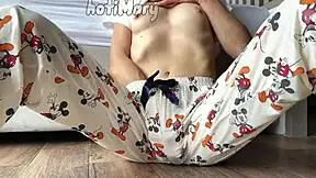 Skinny teen in pajamas masturbates to squirting orgasm