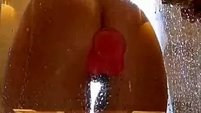Girl with big ass enjoys shower fun with pink dildo?