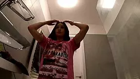 hottest redhead strips in the bathroom, ripping her t-shirt and panties to show her ass and pussy