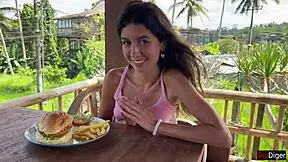 cute girl eating burger with cum on face during public cafe cumwalk