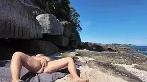 A curvy young woman enjoys nudism on the beach