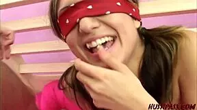 Young Sammy Cruz, blindfolded, takes on her first freaky experience