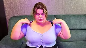 BBW student teases teacher with big boobs, hand motions, and rips buttons on her top.