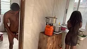 Newly married couple having passionate sex in the kitchen.