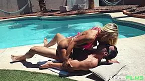 The muscular blonde gives a blowjob by the pool, getting covered in dripping cum