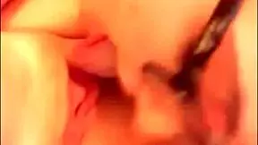 Two young brunette lesbians relax on the bed