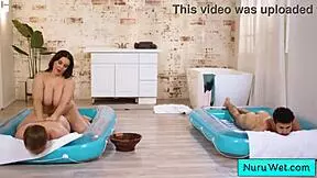 sexy busty masseuse fucks two young boys during nuru massage