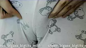 In her pajamas, this mature Latina milf rubs herself solo. Her big tits and wet curves tell a steamy story.