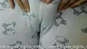 In her pajamas, this mature Latina milf rubs herself solo. Her big tits and wet curves tell a steamy story.