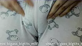 In her pajamas, this mature Latina milf rubs herself solo. Her big tits and wet curves tell a steamy story.