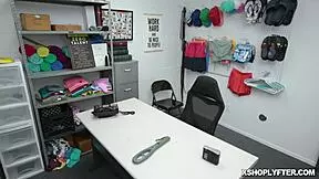 Security guard confronts shoplifter Emma Starletto in office