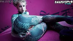 Hey, check out this tattooed girl stretching her asshole with toys and plugs! 😜