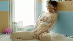 Hot Russian babe dildoing underwater in steamy bath scene