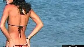 Jessica's hot bikini dance on the beach is pure fire! 🔥