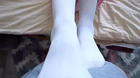 My stepbrother claims I give the best footjobs, but is it true in this homemade POV?