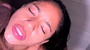 Cute brunette blows BBC in bathroom.