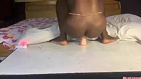 Naija teen sits on huge dildo for satisfaction.