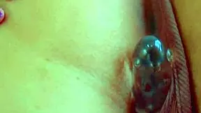 Desi beauty masturbates with glass dildo in close-up, her hairless pussy glistening