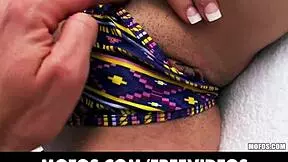 sun bathing beauty teases by sliding her bikini bottoms aside for a sneaky peek