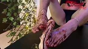 she sucks chocolate off my feet in a playful way