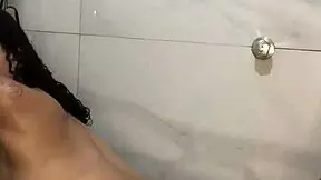 fucking a big-ass brunette in the bathroom ends with cum on her face