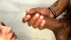 fucking a big-ass brunette in the bathroom ends with cum on her face