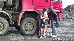 petite blonde hottie gets fucked in a public threesome by two guys at the construction site. she sucks cocks and gets her pussy pounded outdoors