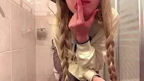 Hey, watch Lil Rose, horny blonde, squirt in college bathroom!